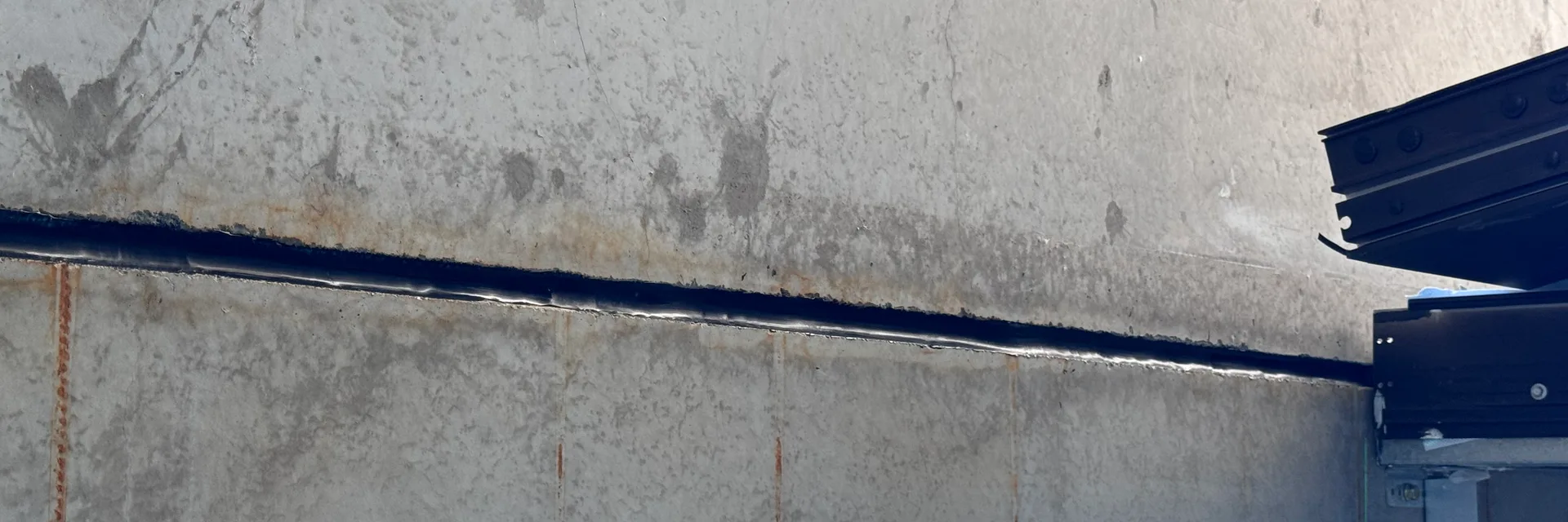 A sealed polyurethane expansion joint running across precast concrete on an Adelaide building site.
